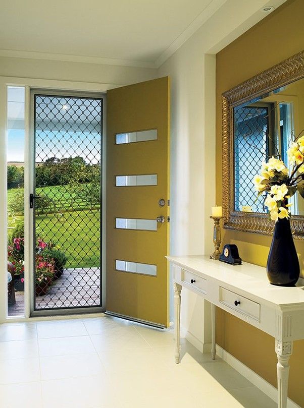 Professionally Installed Diamond Grille Safety Screen Door A perfectly installed diamond grille security screen door with high-strength mesh security screens for maximum protection and style.